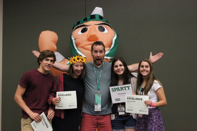 Brian Roberts poses with students who won awards for work in his photo class as the 2014 MIPA Summer Journalism Workshop.