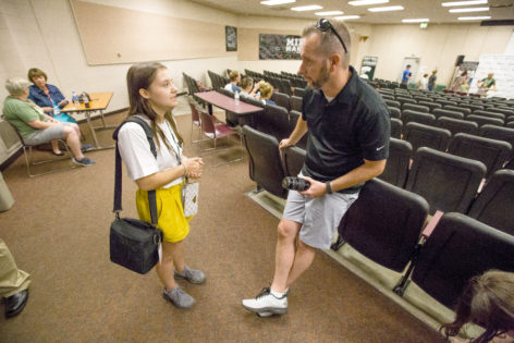Brian Roberts takes with a student while visiting the 2019 MIPA Summer Journalism Workshop at Michigan State University. 